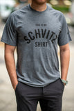 A man in NYC wearing a grey workout T-shirt that says "This is my SCHVITZ Shirt"