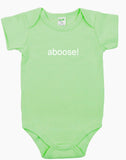 Green baby onesie with the word ‘aboose!’ printed in white on the front.