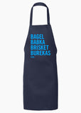 A black apron that says "Bagel, Babka, Brisket, Burekas" in bright blue letters.
