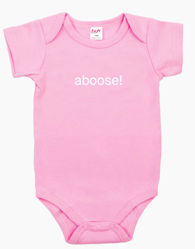 Pink baby onesie with the word ‘aboose!’ printed in white.
