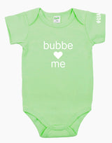Green onesie that says "bubbe loves me" in white letters on the front. There is a heart instead of the word love. 
