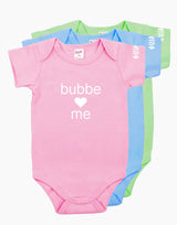 Pink, Blue and Green onesies that say "bubbe loves me" in white letters on the front. There is a heart instead of the word love. 